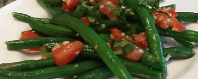 green beans and tomatoes on a plate